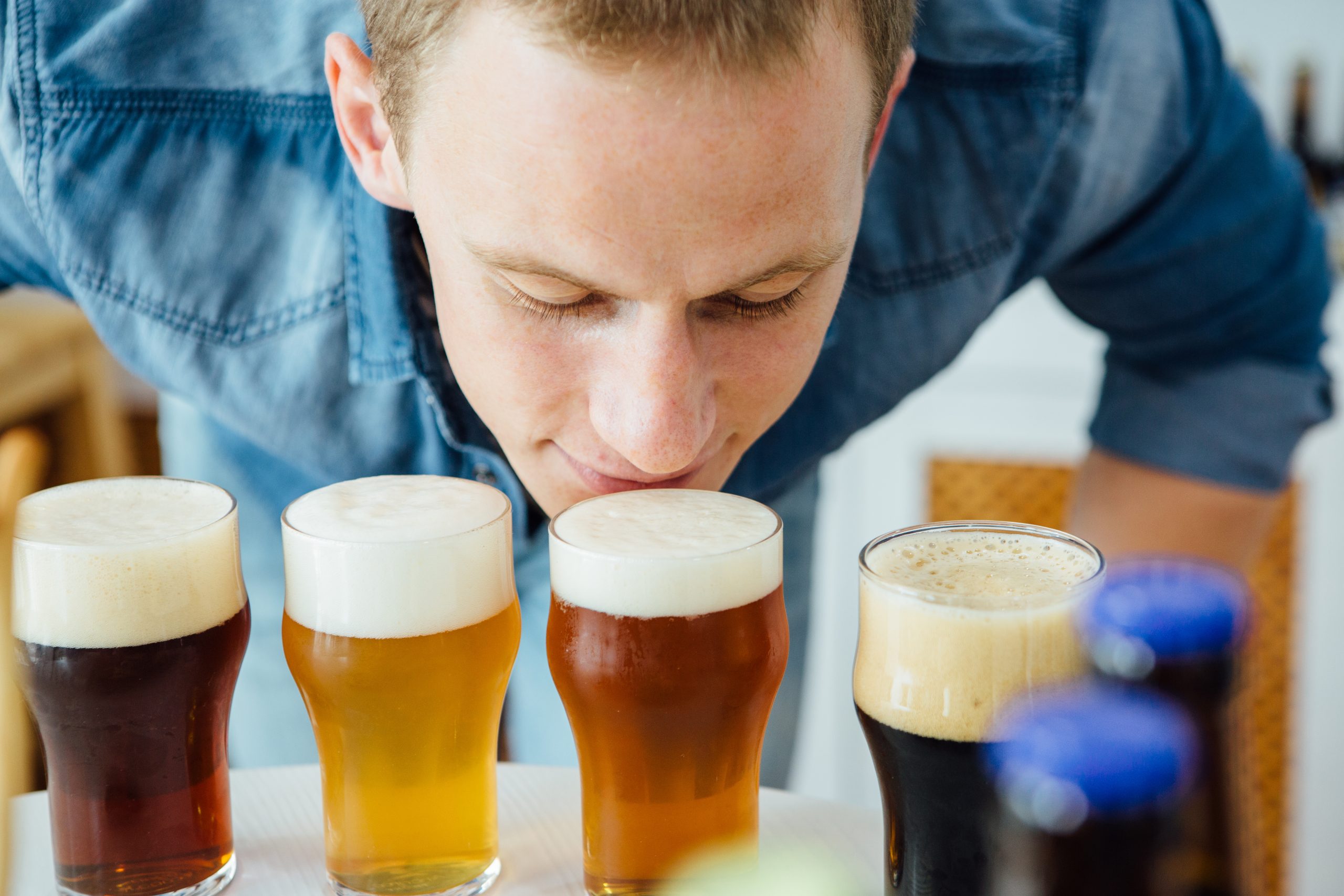 Man smelling craft beer